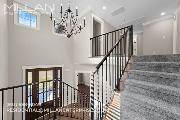 a view of entryway with wooden floor