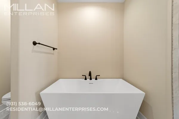 a white bath tub sitting in a bathroom