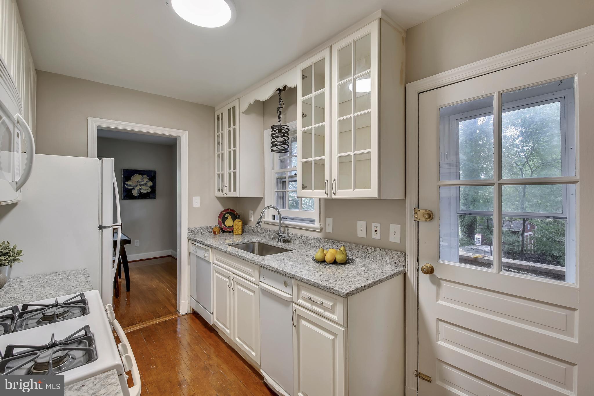 305 Wayne Place Silver Spring, MD 20910 - Photo 12 of 29 a kitchen with a sink and cabinets