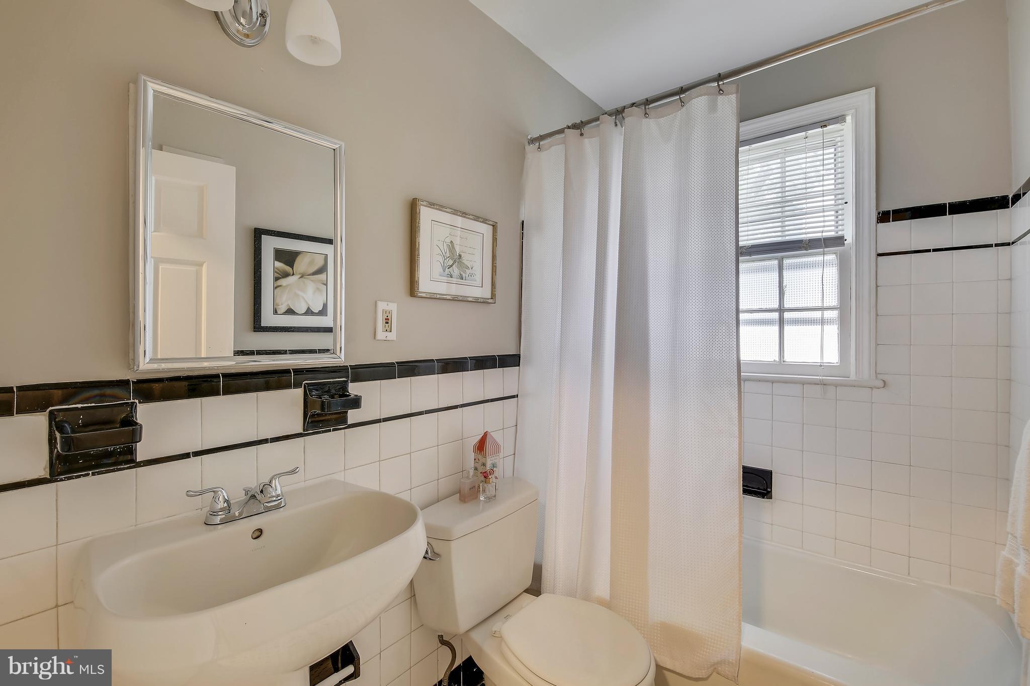 305 Wayne Place Silver Spring, MD 20910 - Photo 15 of 29 a bathroom with a sink and a mirror