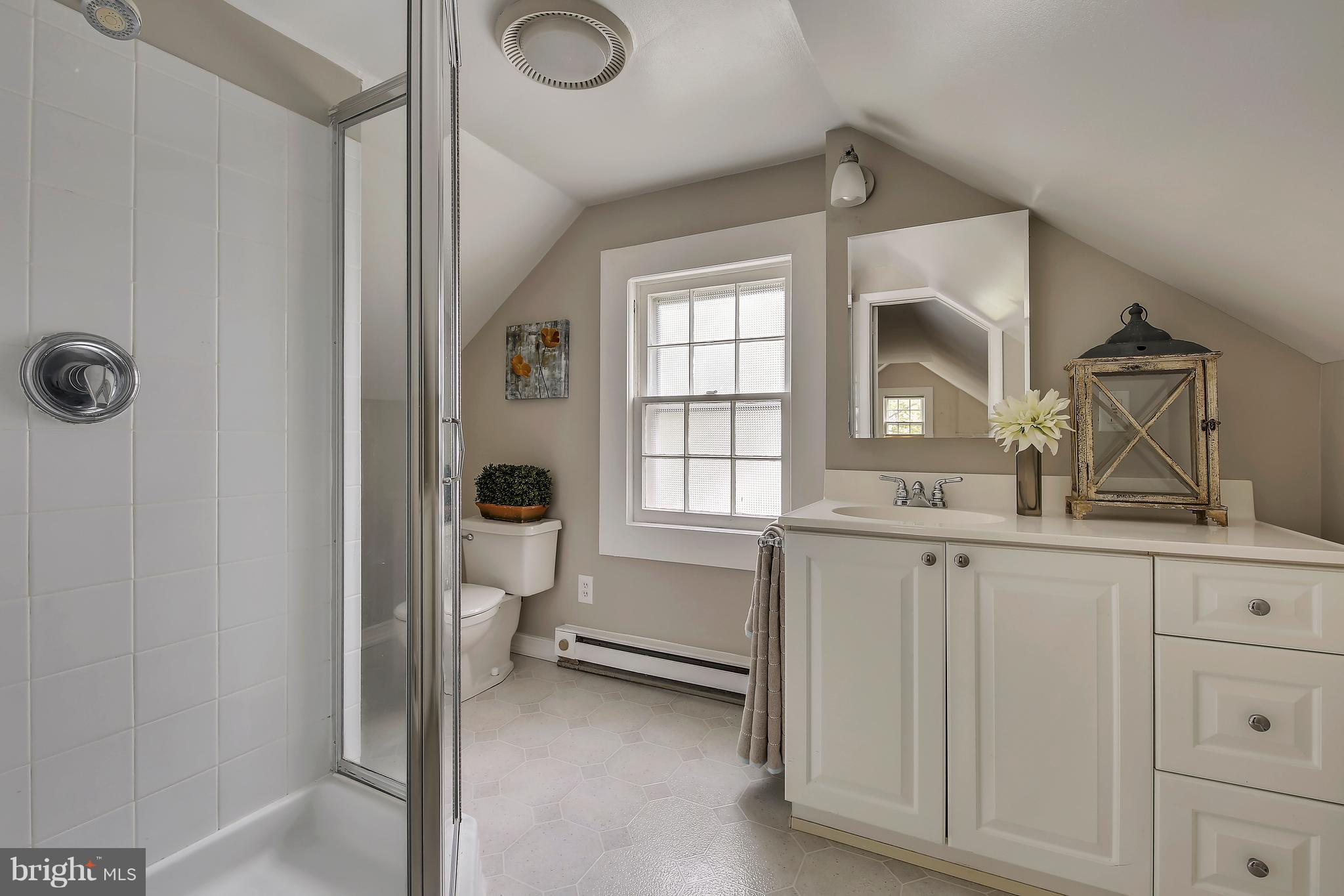 305 Wayne Place Silver Spring, MD 20910 - Photo 19 of 29 a bathroom with a sink and a mirror