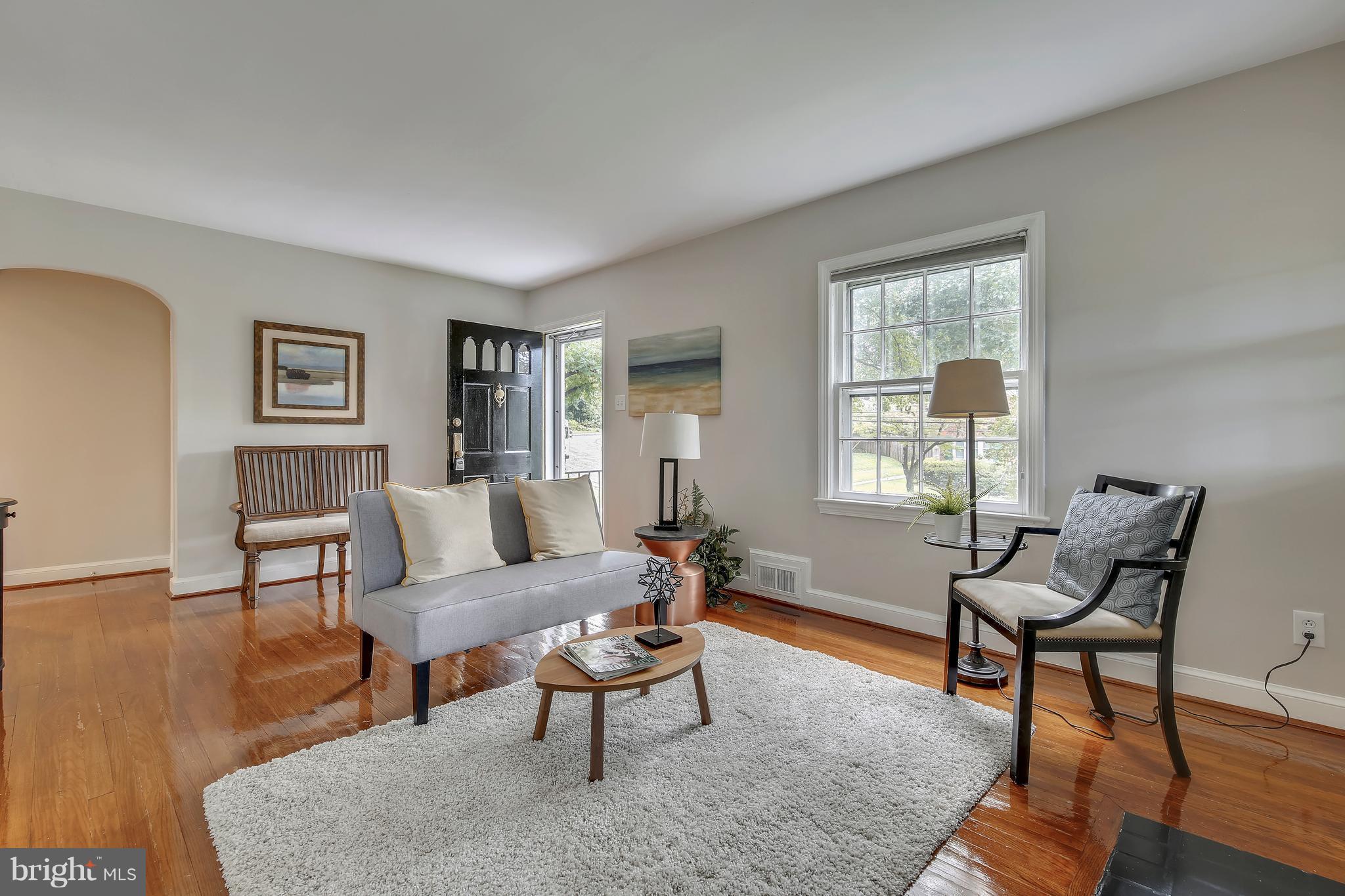 305 Wayne Place Silver Spring, MD 20910 - Photo 3 of 29 a living room with furniture and a window