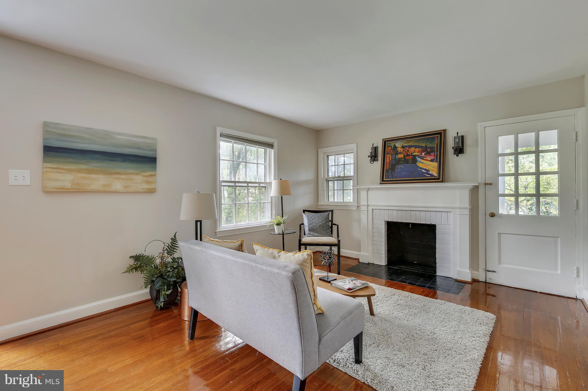 305 Wayne Place Silver Spring, MD 20910 - Photo 4 of 29 a living room with furniture and a fireplace