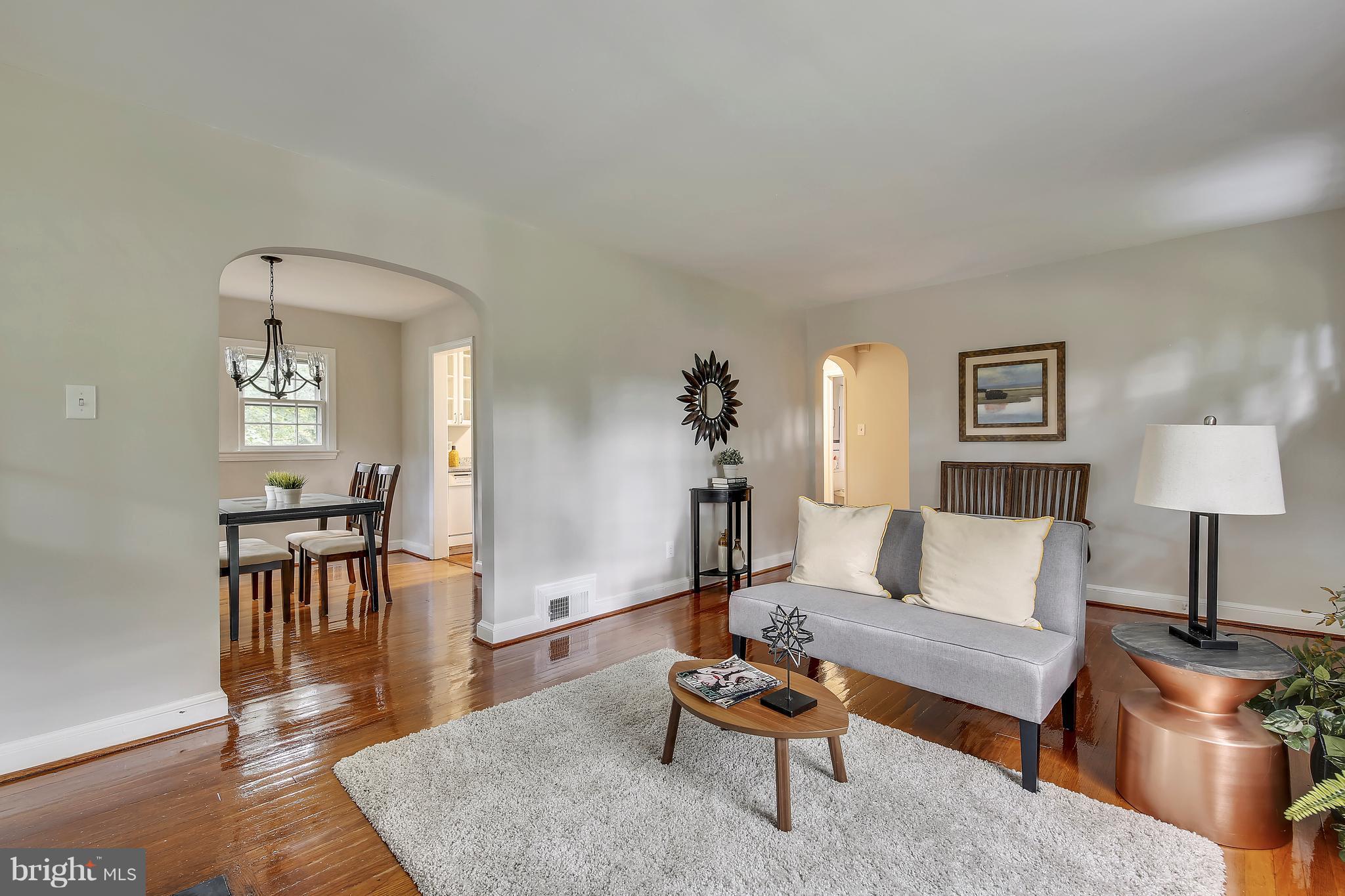305 Wayne Place Silver Spring, MD 20910 - Photo 6 of 29 a living room with furniture and a wooden floor