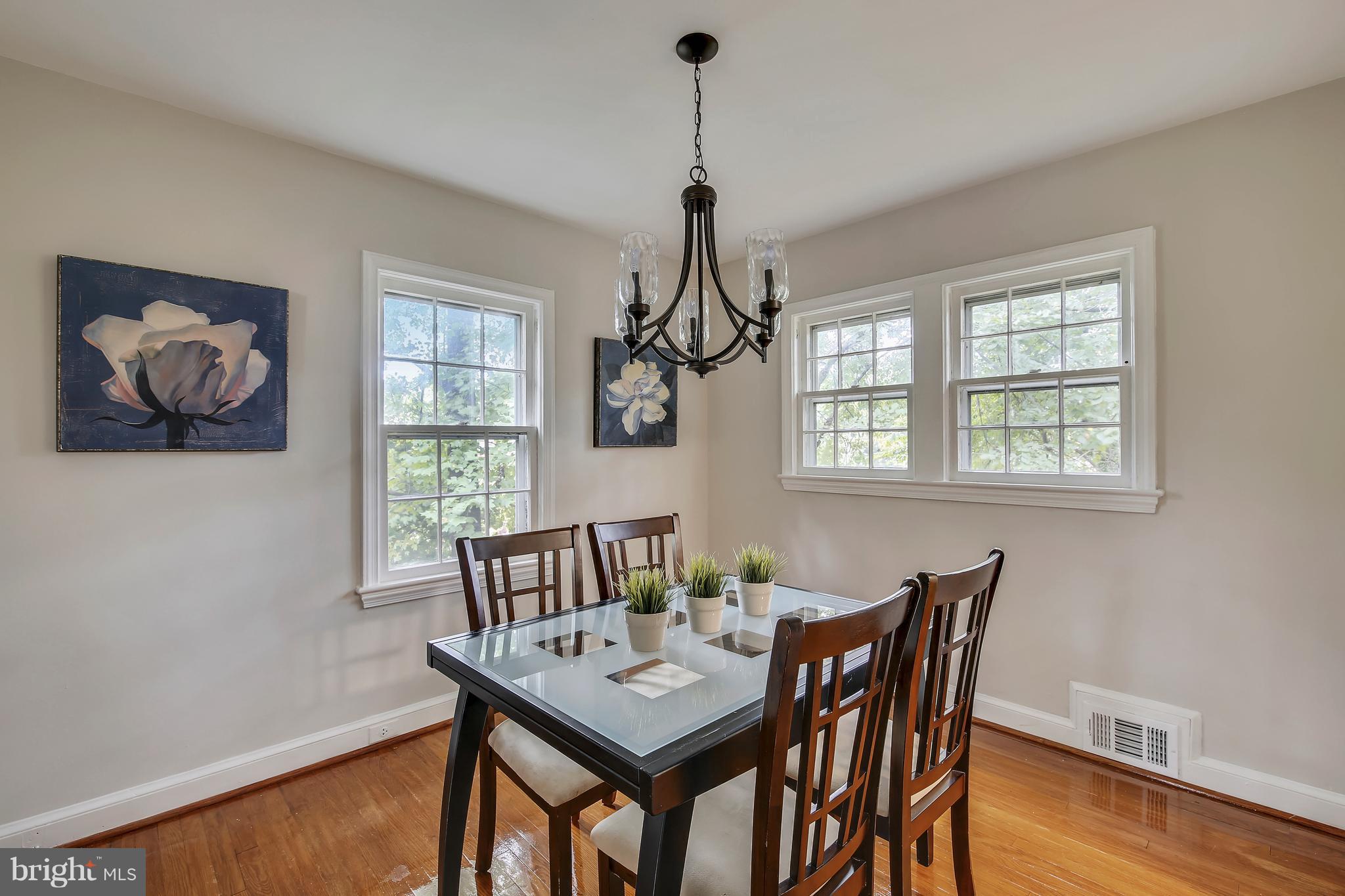 305 Wayne Place Silver Spring, MD 20910 - Photo 8 of 29 a view of a dining room with furniture window and wooden floor