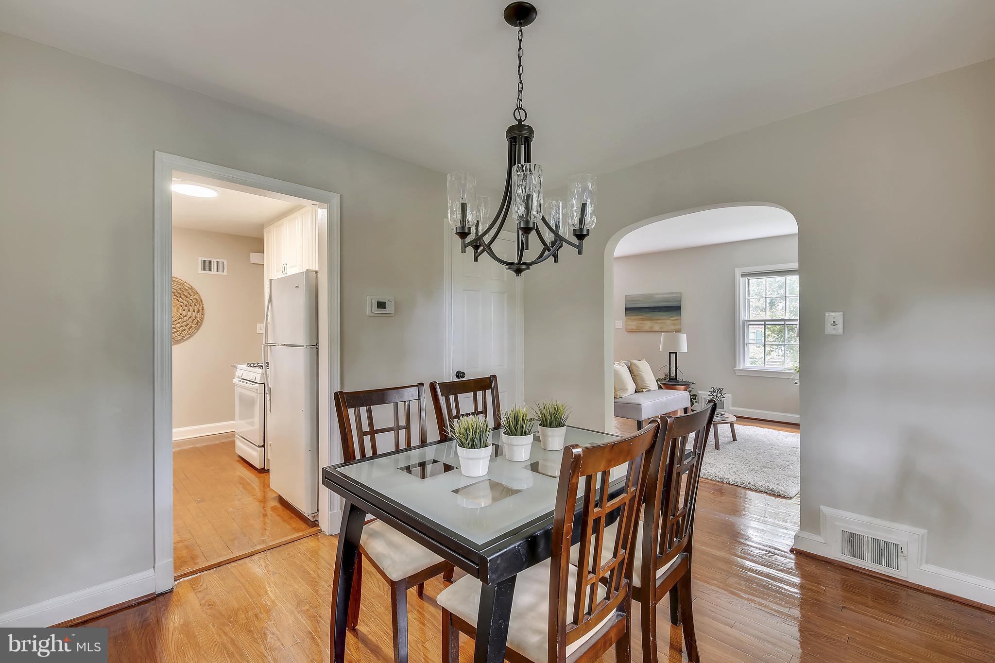 305 Wayne Place Silver Spring, MD 20910 - Photo 9 of 29 a view of a dining room with furniture and wooden floor