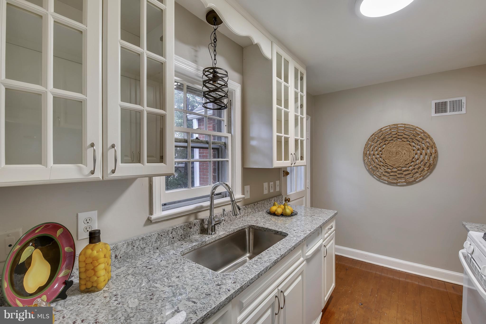 305 Wayne Place Silver Spring, MD 20910 - Photo 10 of 29 a kitchen with a sink and a stove