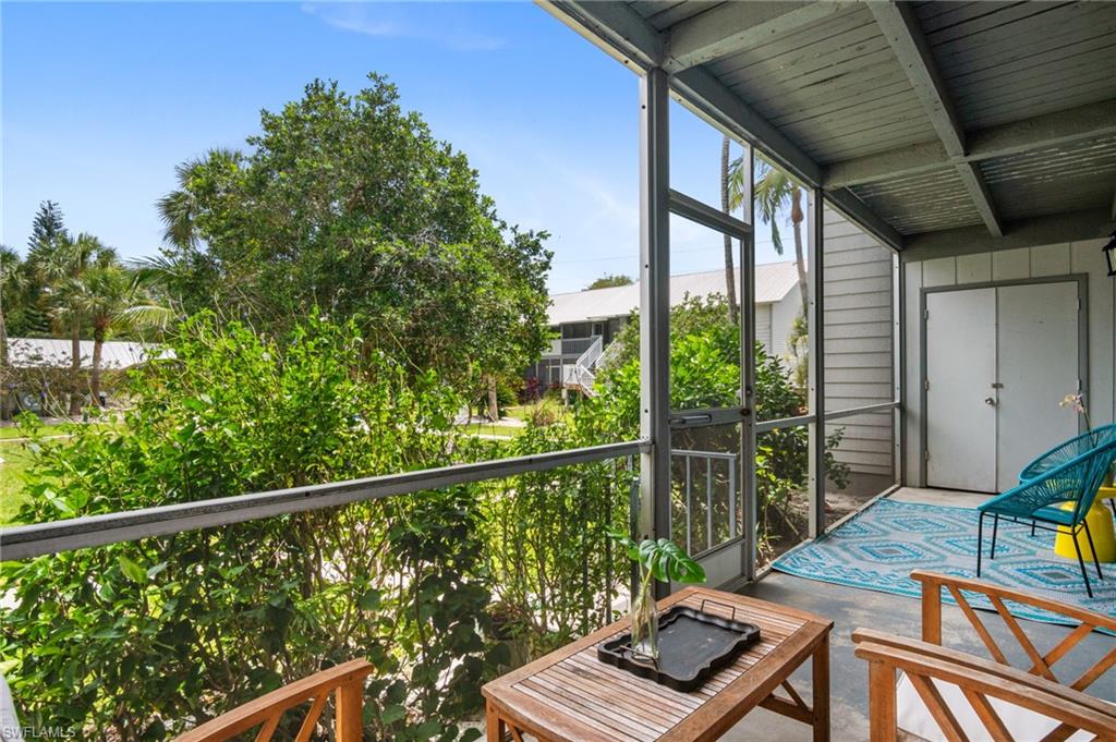 1275 7th Avenue North, Unit 201 Naples, FL 34102 - Photo 31 of 39 Sunroom with beam ceiling