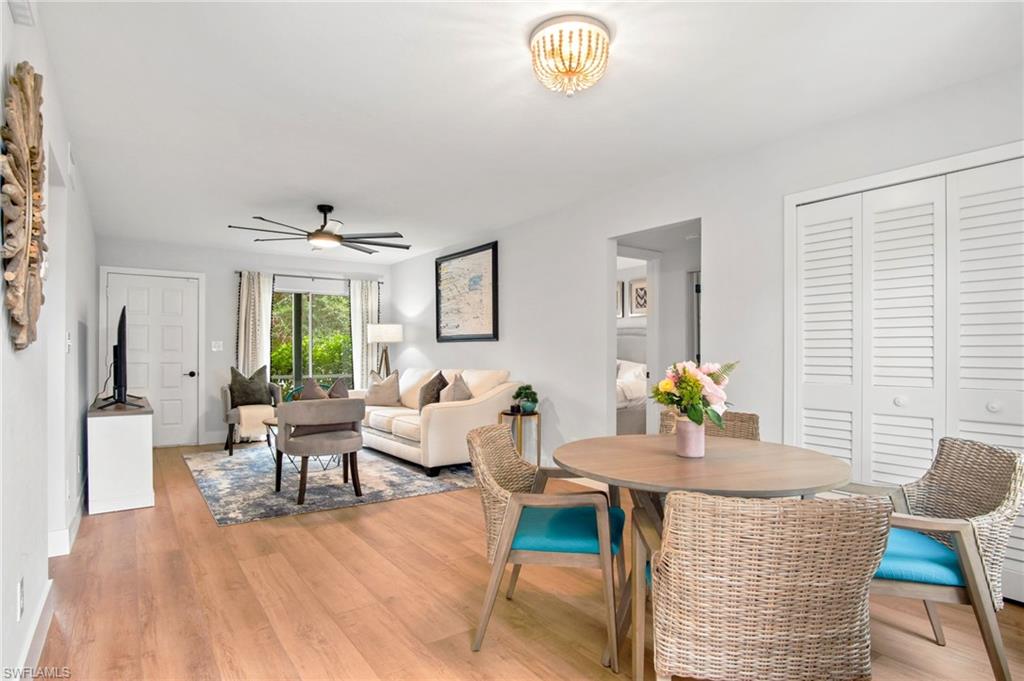 1275 7th Avenue North, Unit 201 Naples, FL 34102 - Photo 10 of 39 Dining area with light wood finished floors and ceiling fan