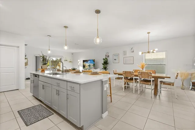 a kitchen with lots of counter top space and dining table