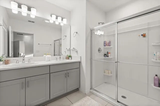 a bedroom with a bed and a chair