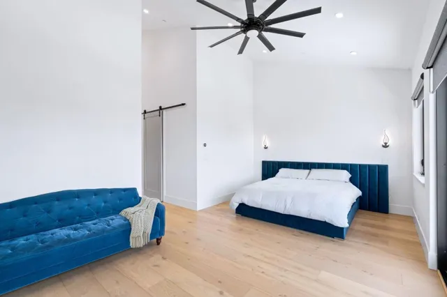 a living room with a bed and furniture