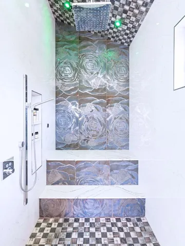 a bathroom with a bathtub and shower