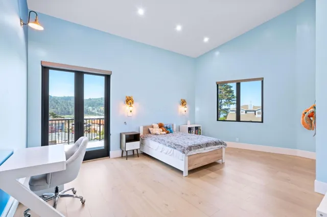 a bedroom with a bed and window