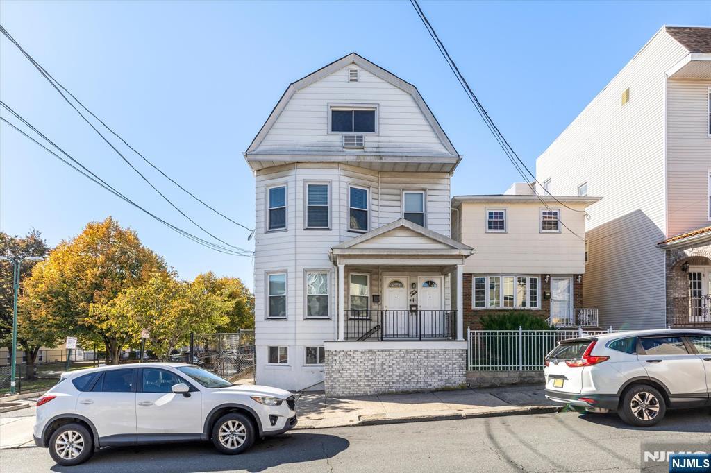 a car parked in front of a house