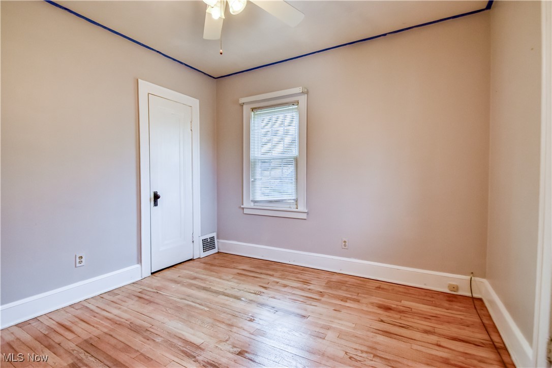 3733 East Antisdale Road Cleveland, OH 44118 - Photo 22 of 28 Unfurnished room with a ceiling fan, baseboards, light wood finished floors, and visible vents