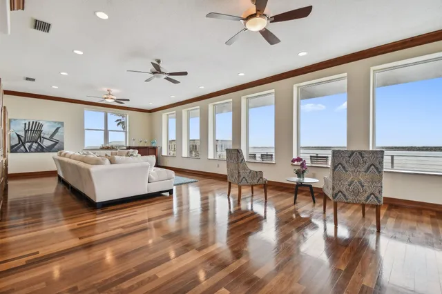 a kitchen with stainless steel appliances granite countertop a sink a stove and a refrigerator