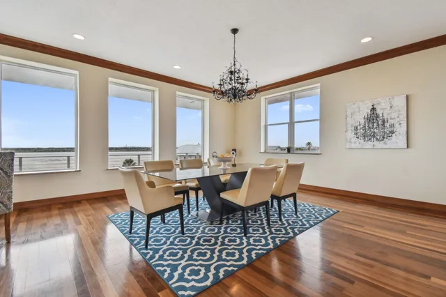 a large kitchen with stainless steel appliances lots of counter space and a sink