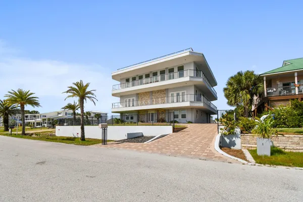 a front view of a building with garden