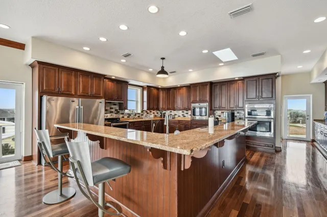 a kitchen with sink cabinets and window
