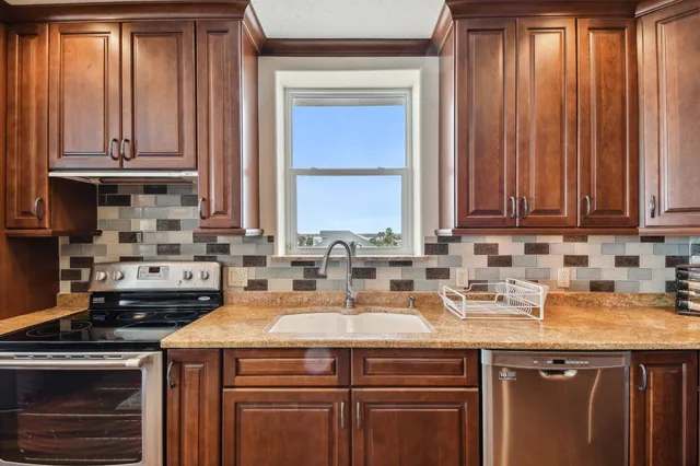 a bathroom with a granite countertop double vanity sink and a mirror