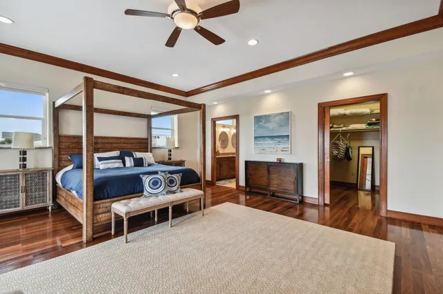 a bathroom with a granite countertop sink a mirror and a bathtub