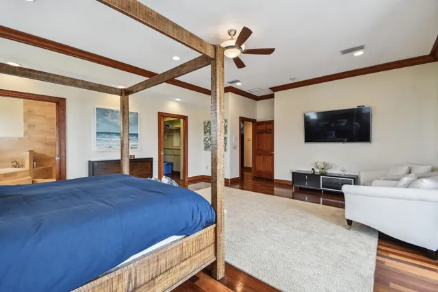 a bathroom with a granite countertop sink a toilet a mirror and shower