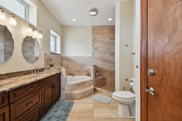 a living room with furniture a window and a chandelier