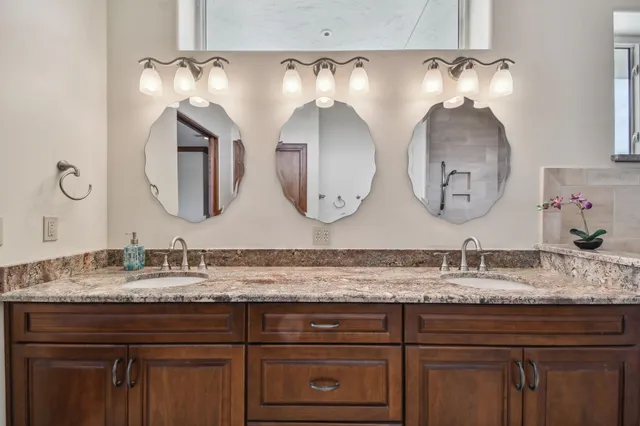 a bedroom with a bed and ceiling fan