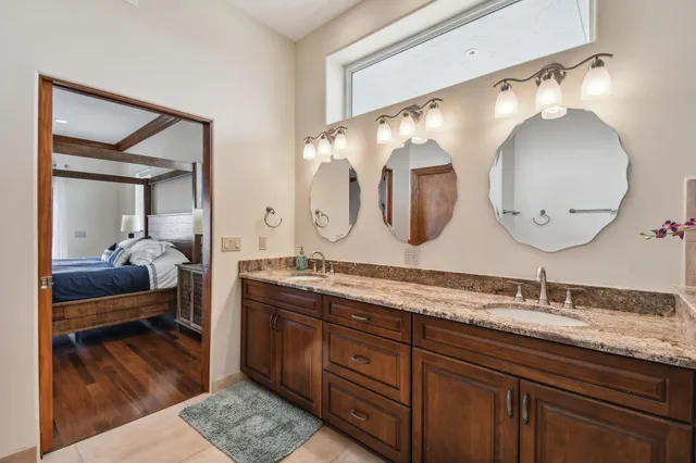 a kitchen with stainless steel appliances granite countertop a stove refrigerator sink and cabinets