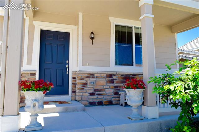 847 Spectrum Loop Colorado Springs, CO 80921 - Photo 2 of 22 Beautiful front porch to relax on in this sought-after neighborhood within D 20 (Discovery Canyon Campus schools)