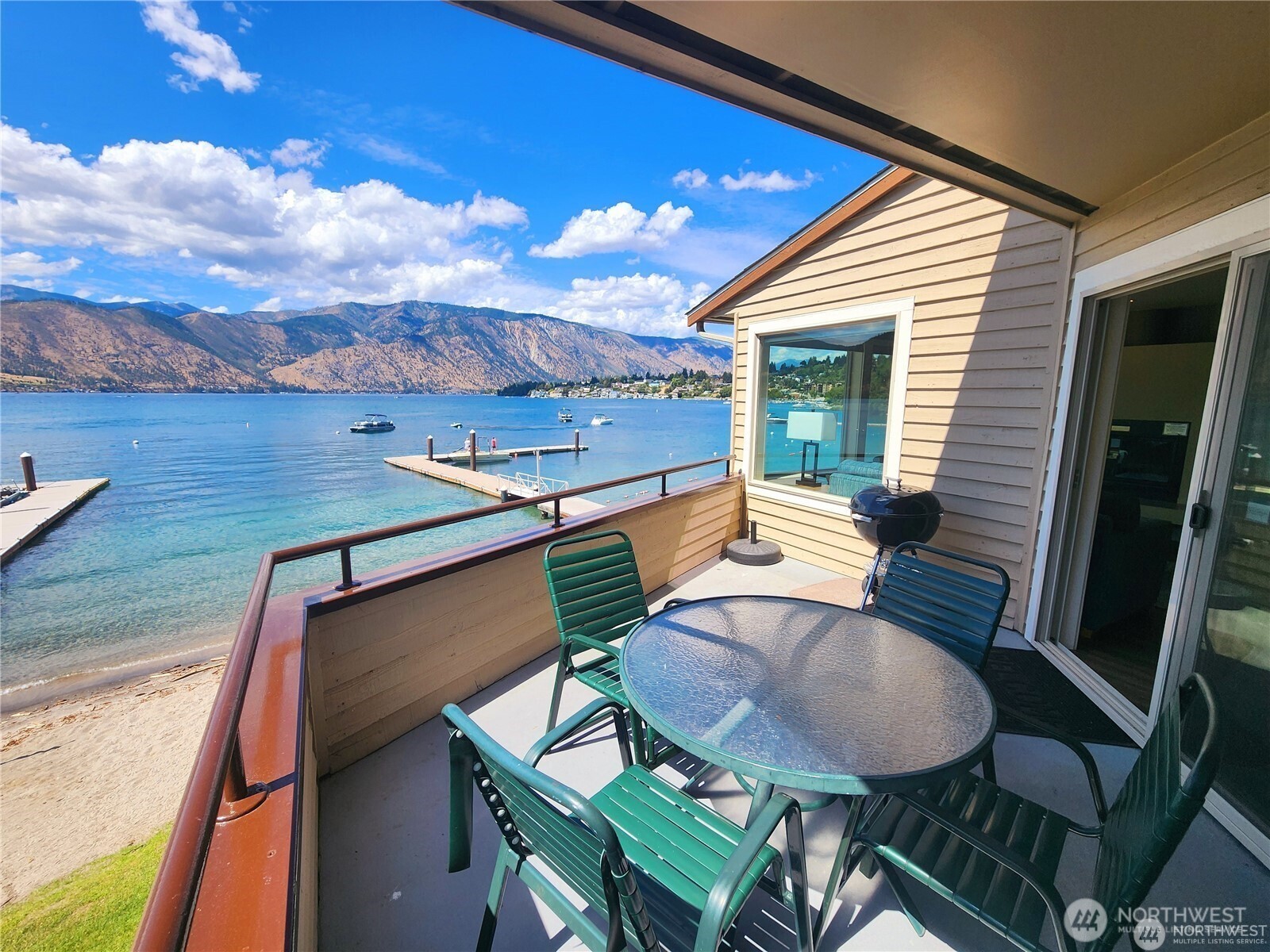 1 Lakeside 720-p Manson, WA 98831 - Photo 15 of 40 a view of a balcony with table and chairs
