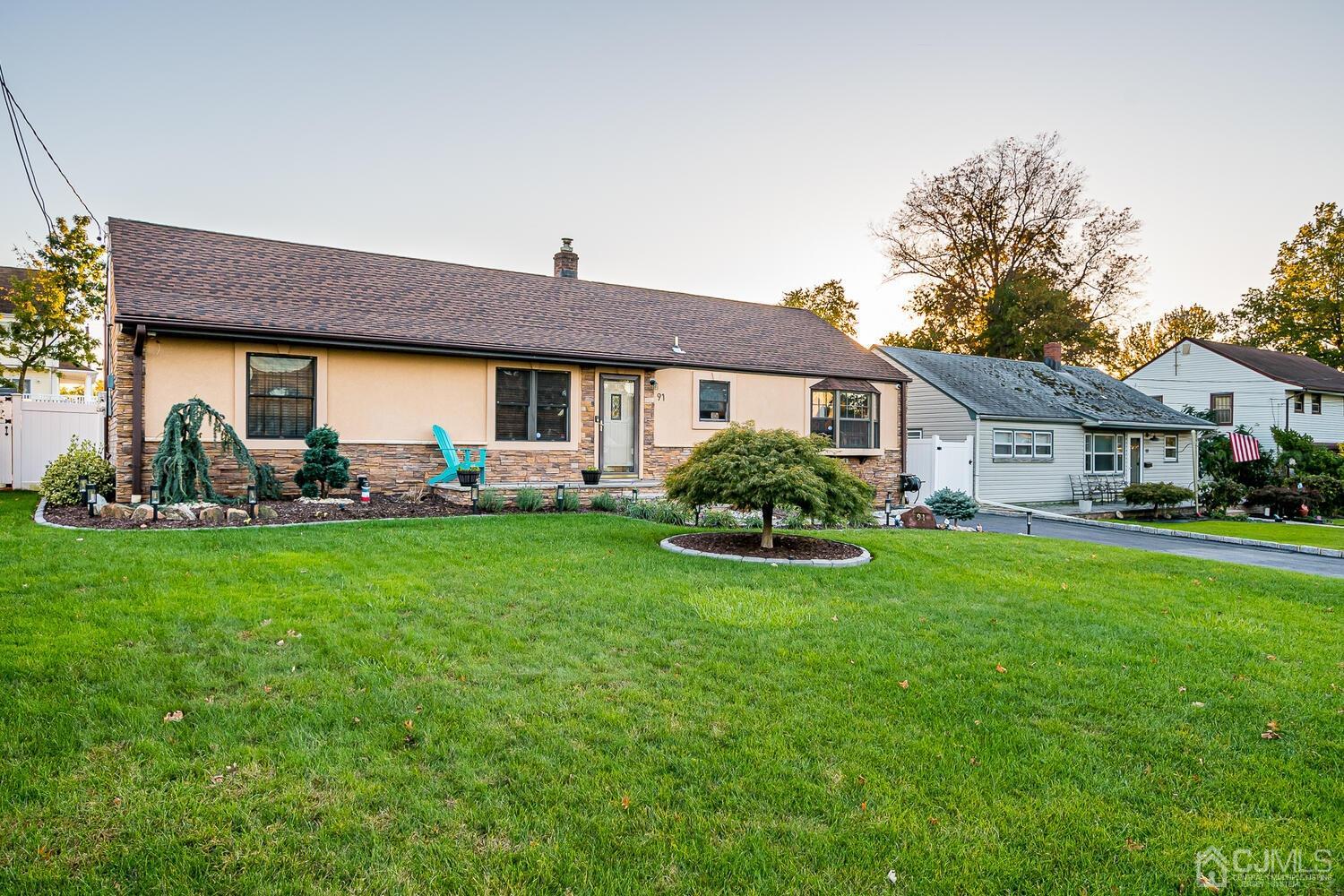 91 South Hill Road Colonia, NJ 07067 - Photo 2 of 46 a view of a house with a yard and sitting area