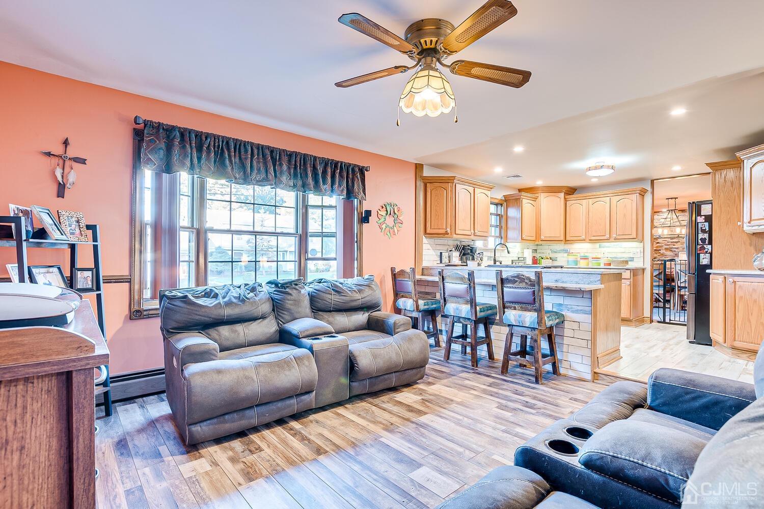 91 South Hill Road Colonia, NJ 07067 - Photo 18 of 46 a living room with furniture and a large window