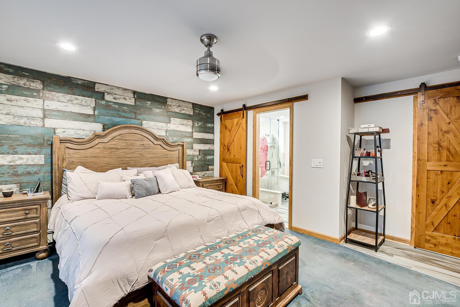 91 South Hill Road Colonia, NJ 07067 - Photo 26 of 46 a bedroom with a bed and a chandelier