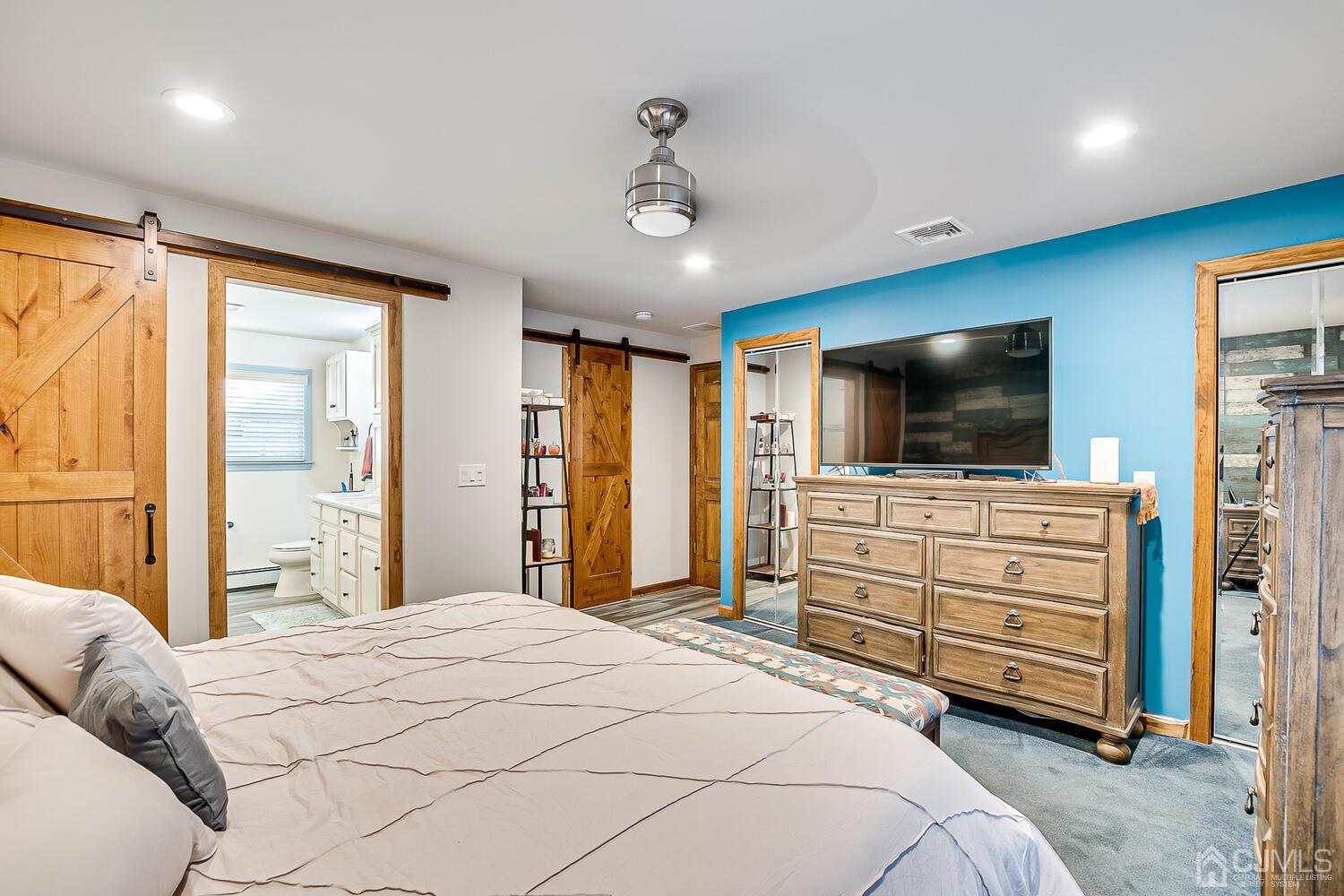91 South Hill Road Colonia, NJ 07067 - Photo 27 of 46 a bedroom with a large bed and flat tv