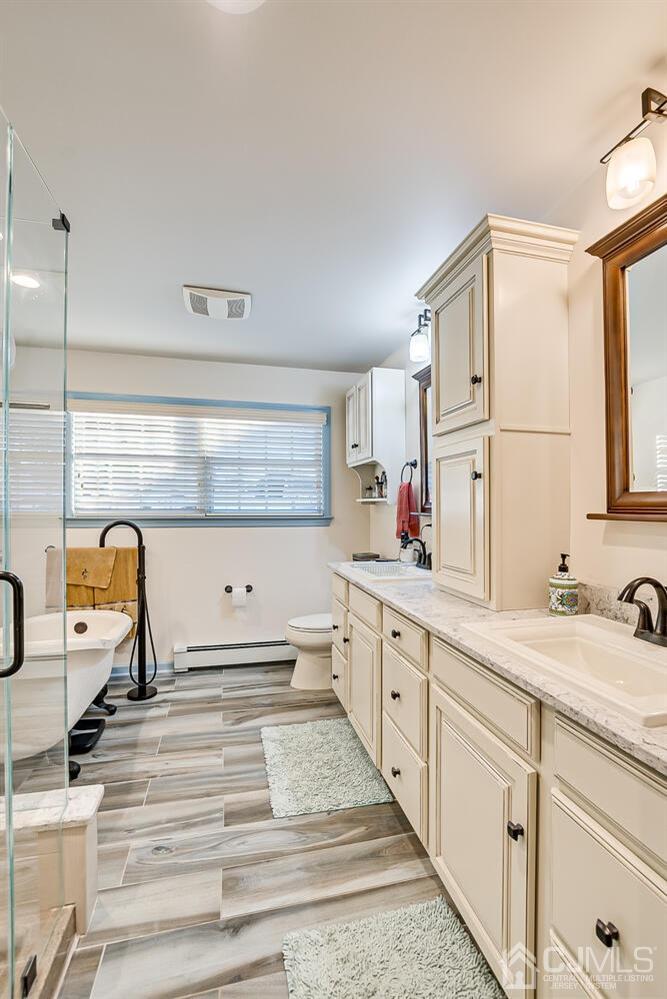 91 South Hill Road Colonia, NJ 07067 - Photo 29 of 46 a spacious bathroom with a sink and a mirror