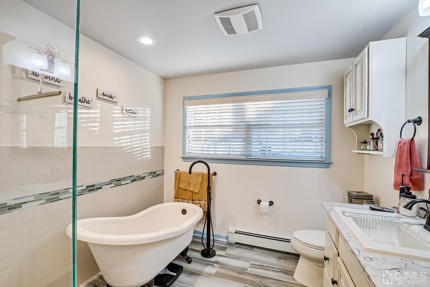 91 South Hill Road Colonia, NJ 07067 - Photo 30 of 46 a bathroom with a sink toilet and shower