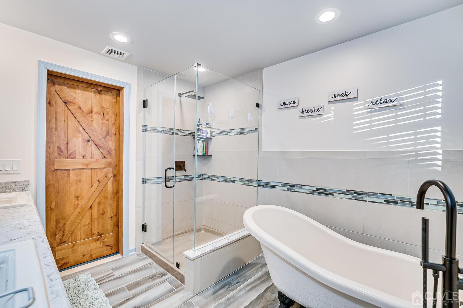 91 South Hill Road Colonia, NJ 07067 - Photo 31 of 46 a bathroom with a bathtub and shower