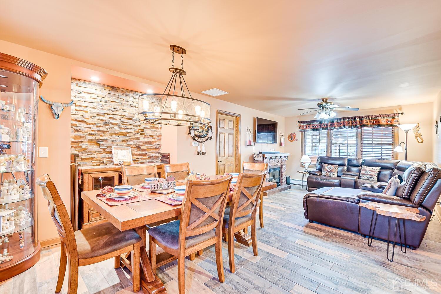 91 South Hill Road Colonia, NJ 07067 - Photo 5 of 46 a dining room with furniture and wooden floor