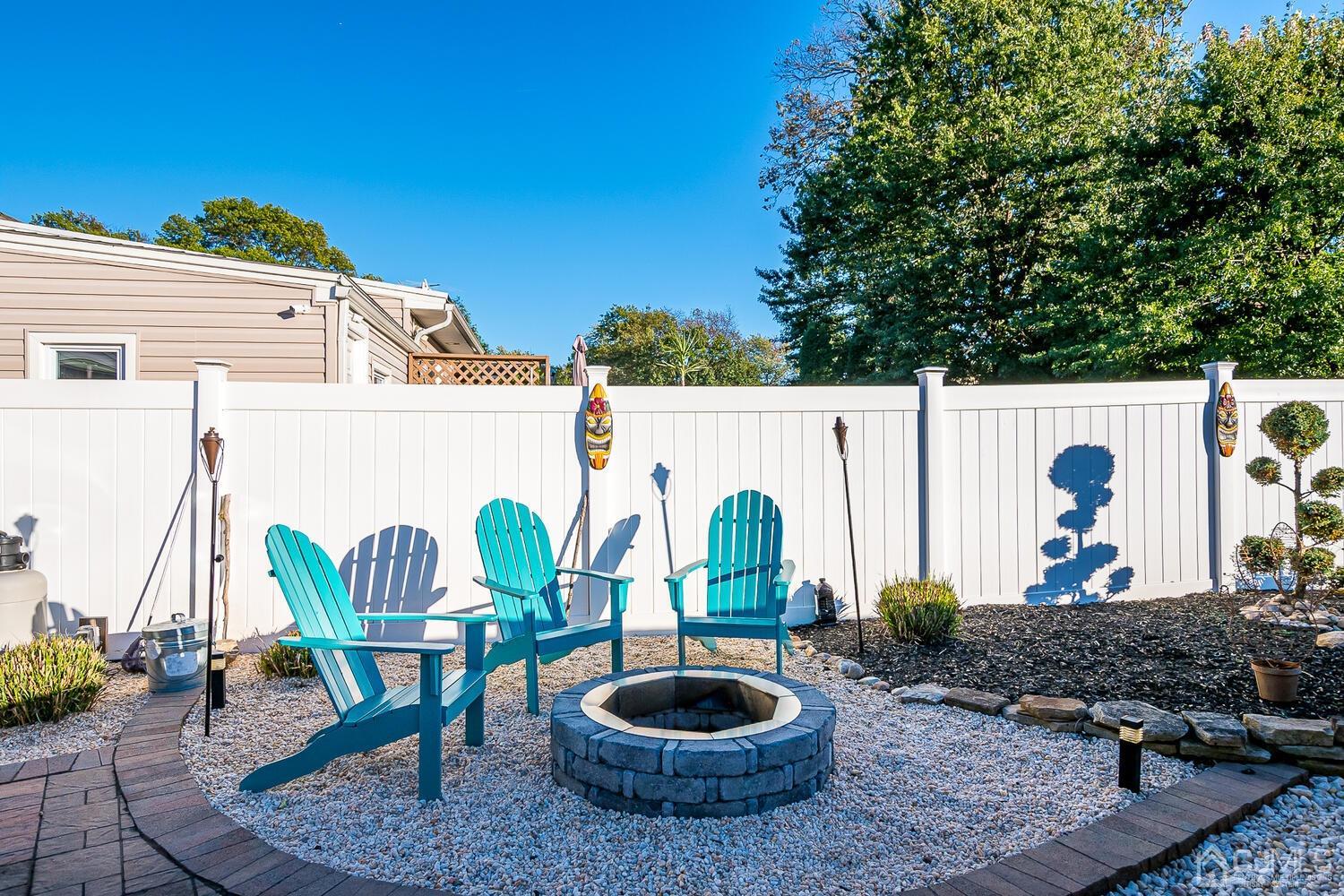 91 South Hill Road Colonia, NJ 07067 - Photo 45 of 46 a backyard of a house with garden and outdoor seating