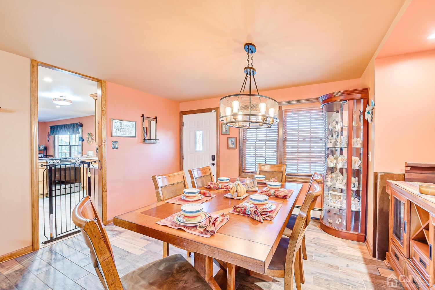 91 South Hill Road Colonia, NJ 07067 - Photo 8 of 46 a view of a dining room with furniture wooden floor and chandelier