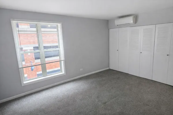 a view of a room that has a window in it