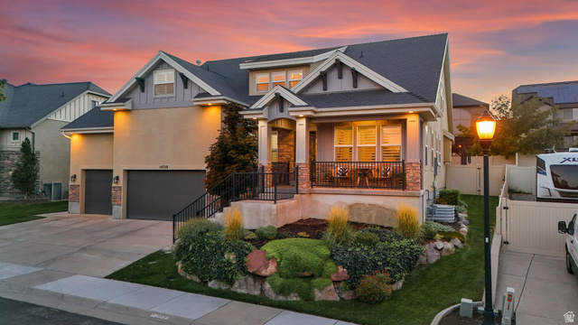 14738 Tangle Hill Road Herriman, UT 84096 - Photo 1 of 66 Multi-level facade featuring stucco and stone veneer accents