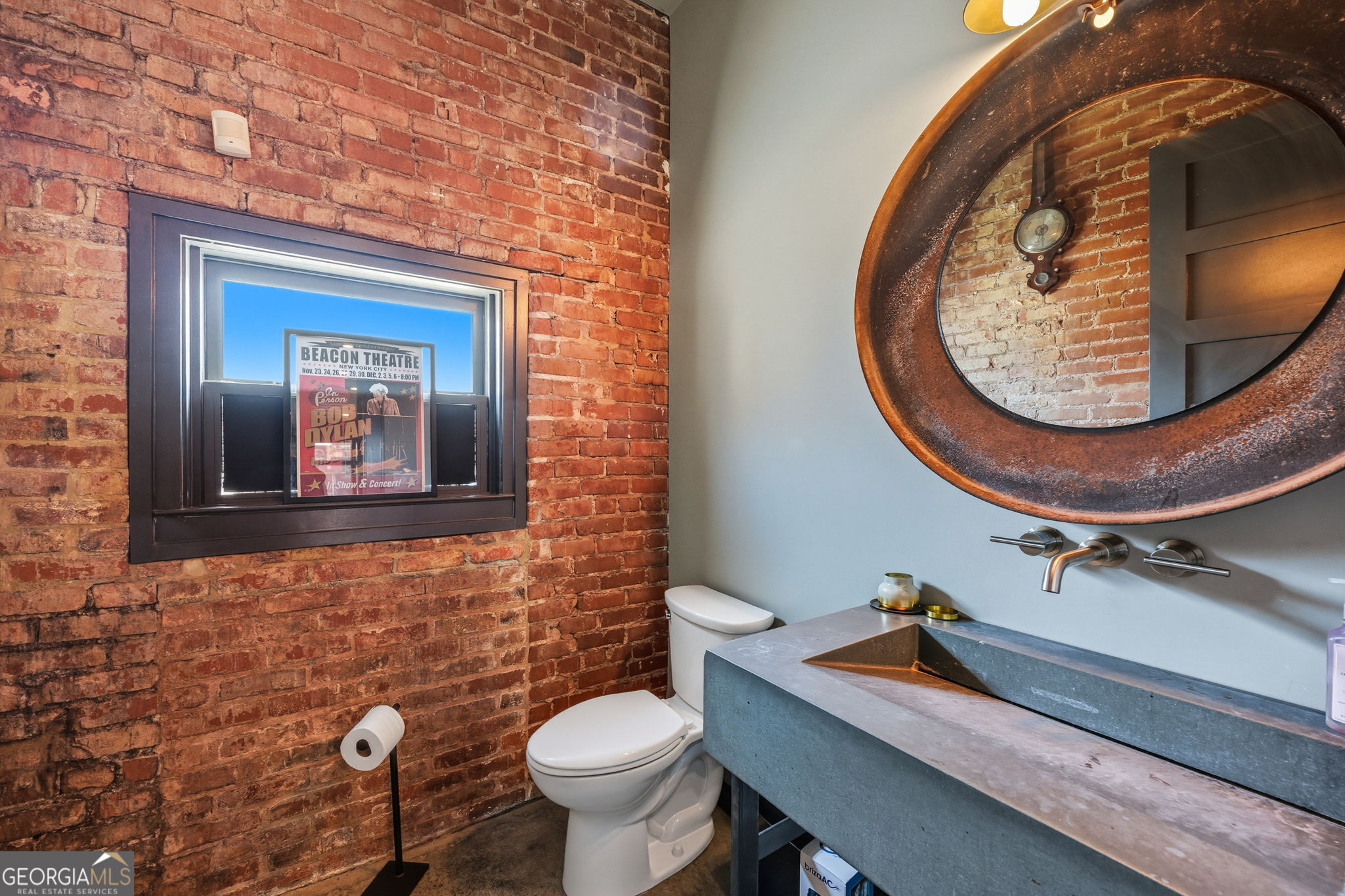 534 2nd Street Macon, GA 31201 - Photo 15 of 25 a bathroom with a toilet sink and mirror