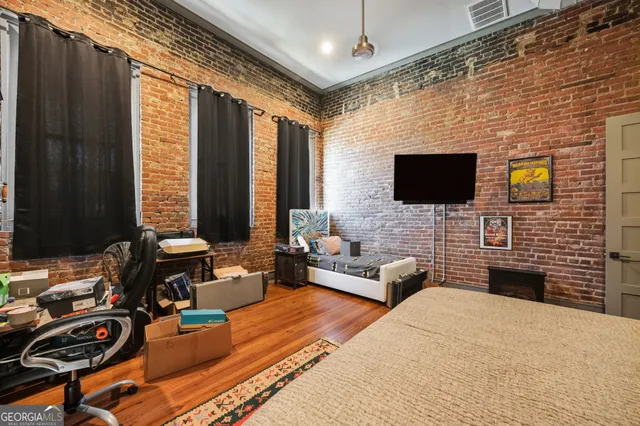 a view of a livingroom with furniture and a flat screen tv