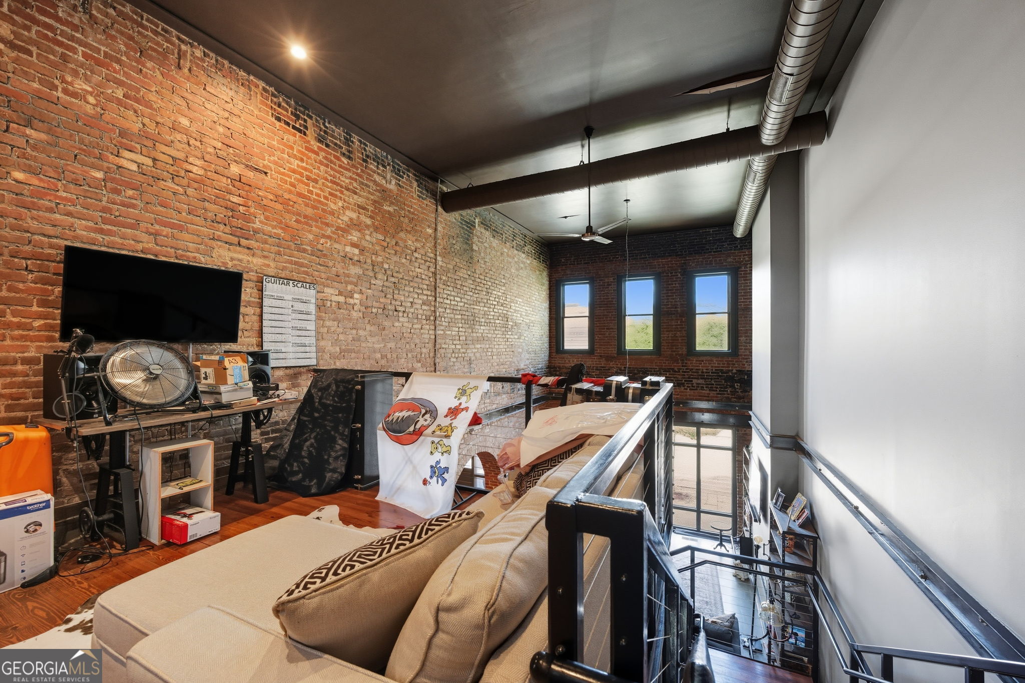 534 2nd Street Macon, GA 31201 - Photo 22 of 25 a view of a livingroom with furniture and a flat screen tv