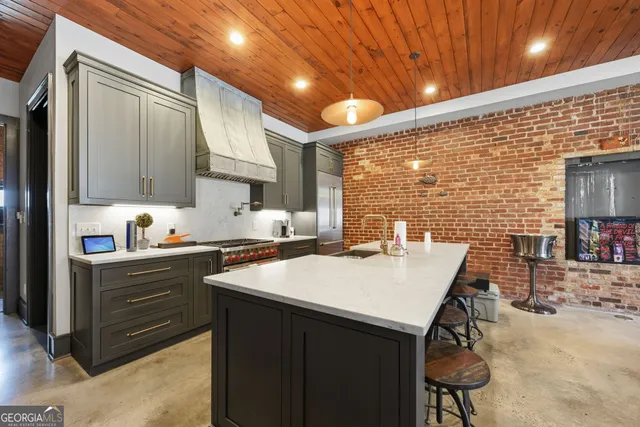a kitchen with a sink cabinets and appliances