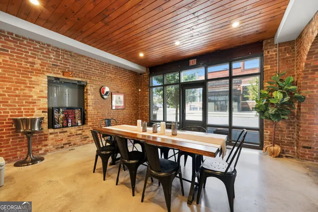 a view of a dining room with furniture window and outside view