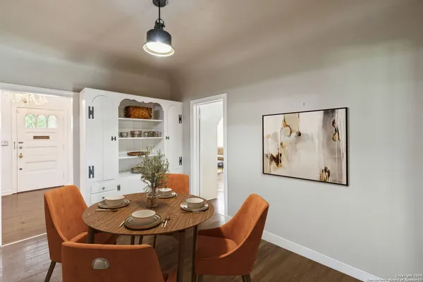 a dining room with furniture and window